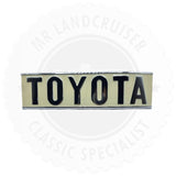 Tidlig Toyota-emblem bagpå (1972-1980)