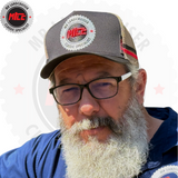 Man wearing a cap with a logo and text, on a white background